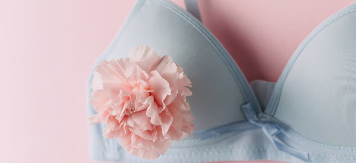 The photo shows a bra with a flower.