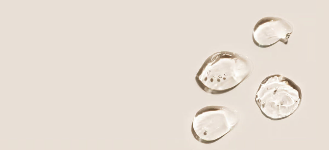 Hyaluronic acid drops on a light background