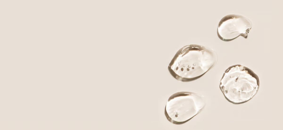 Hyaluronic acid drops on a light background