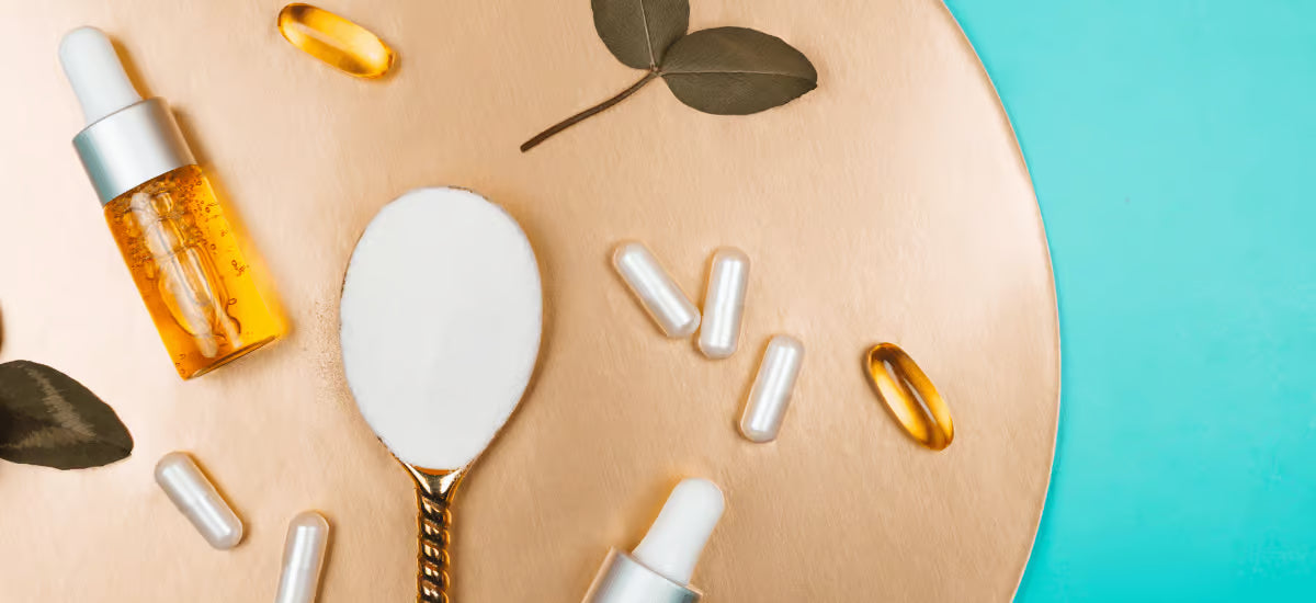 Collagen in liquid form on a decorative tray with a spoon and medicines