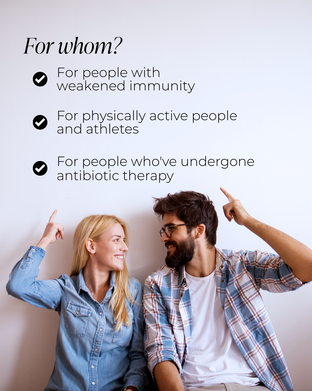 Smiling couple points at Colostrum benefits for immunity, active people, and those after antibiotics